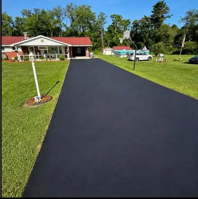 The same long driveway finished in an even black coat