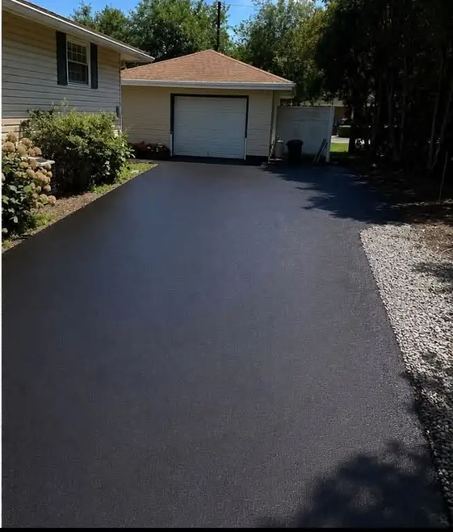 The same driveway sealed black with a clean gravel edge